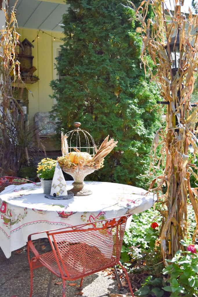 Fall porch table with vintage DIY projects.