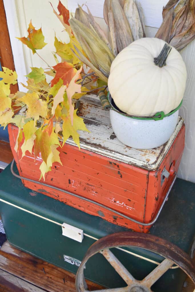 Old metal coolers as Fall porch decor.
