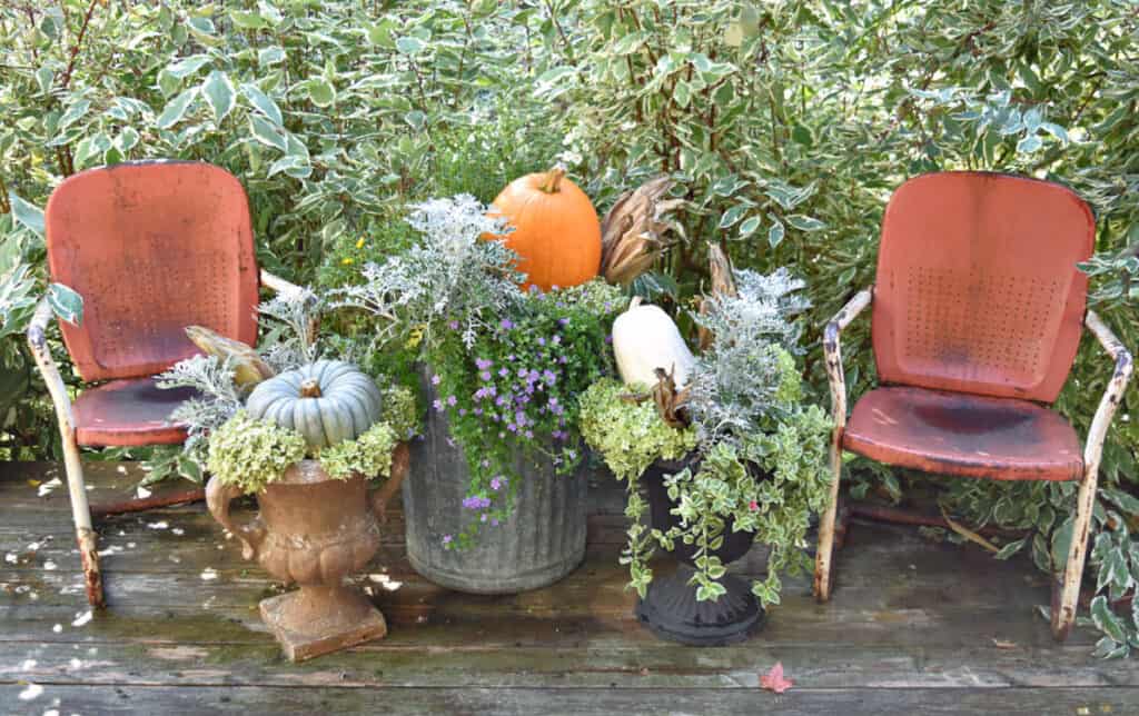 Vintage metal chairs as Fall porch decor.