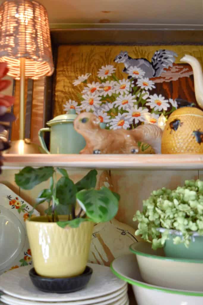Vintage squirrel accessories in Fall hutch display.