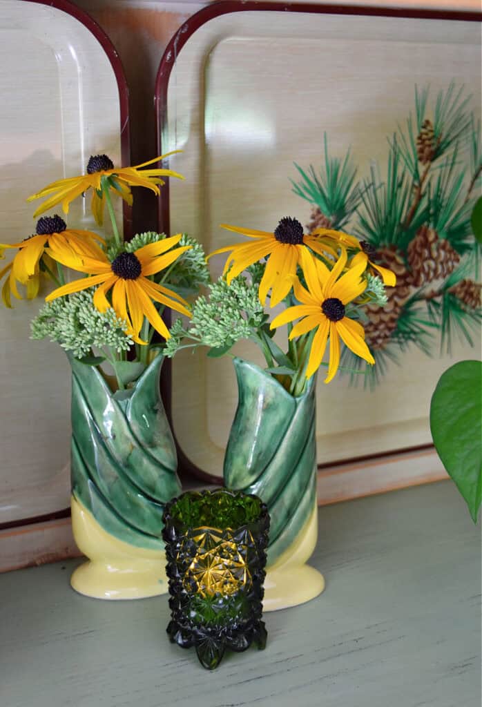 Vintage corn vases with Fall flowers.