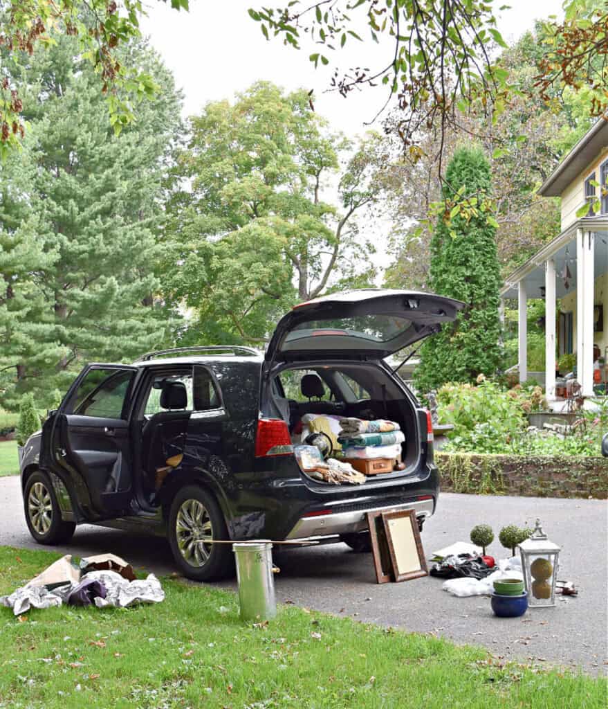 Car trunk open with vintage finds.