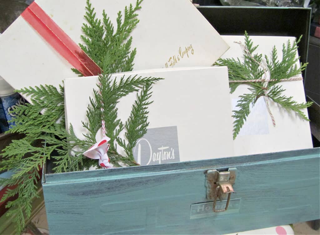 Vintage store boxes in toolbox as Christmas decor.