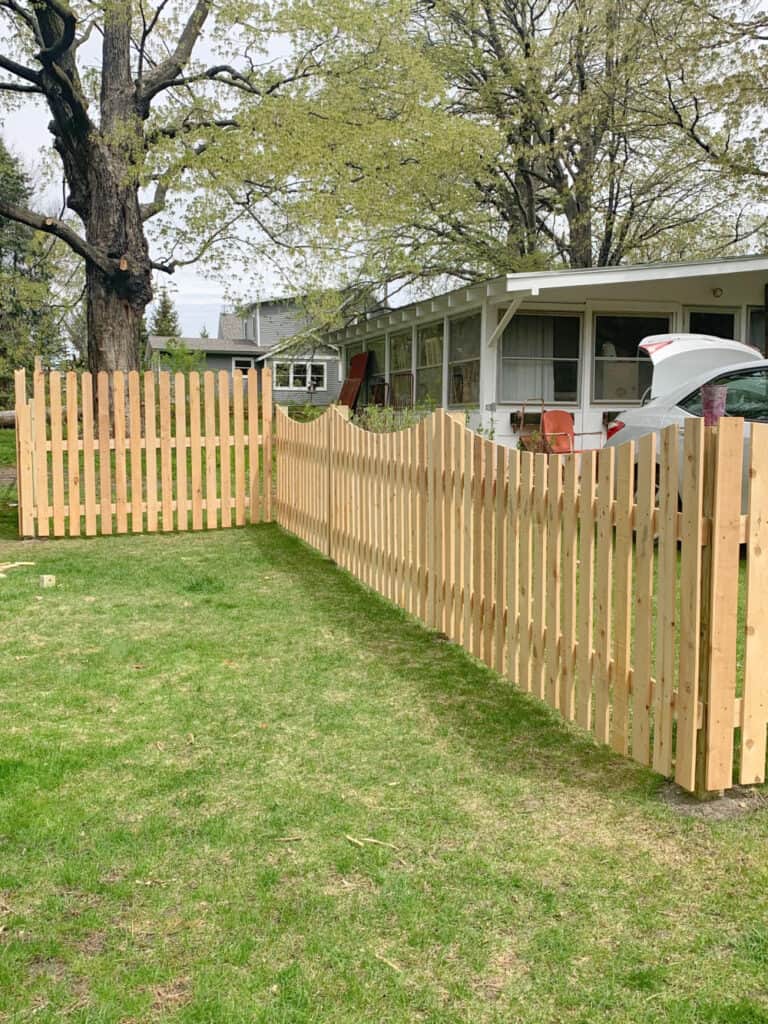 Custom made wooden picket fence for garden.