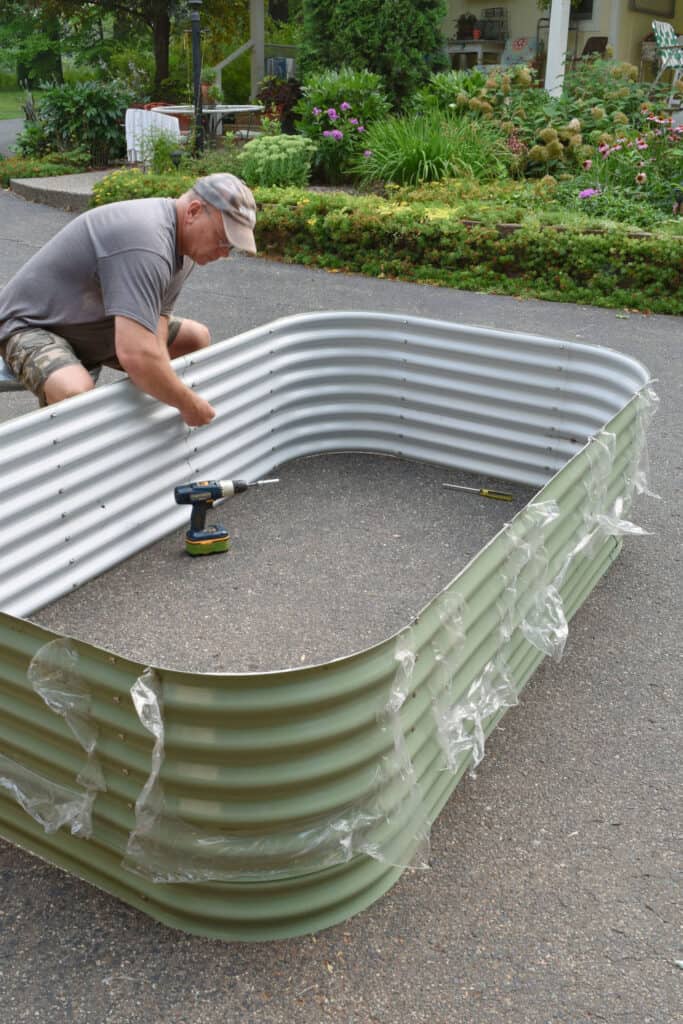Putting together Vego garden raised bed.