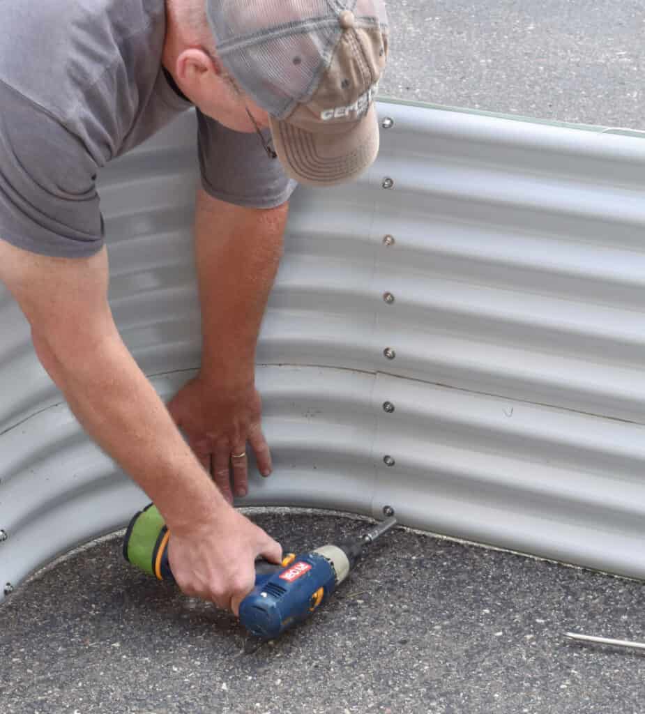 Putting together Vego garden raised bed garden container.