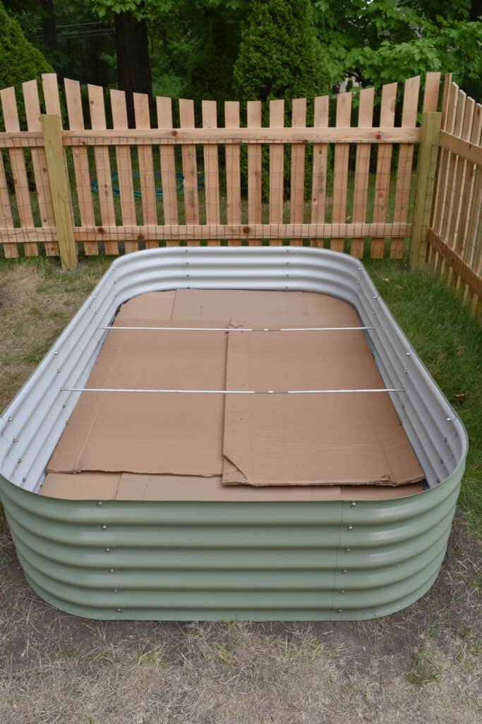 Vego garden raised bed container in fenced garden.