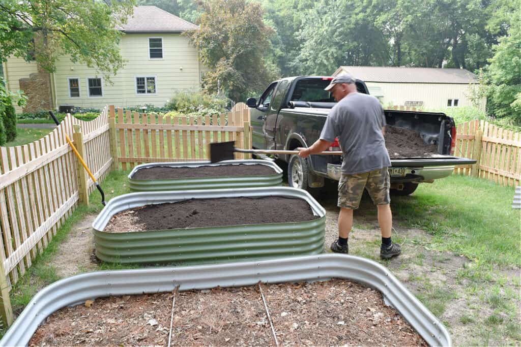 Vego garden raised bed container in fenced garden.