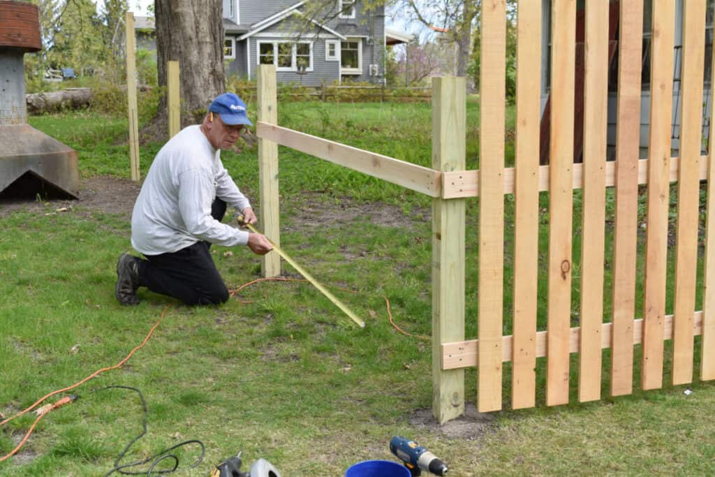 Building a custom picket fenced garden.