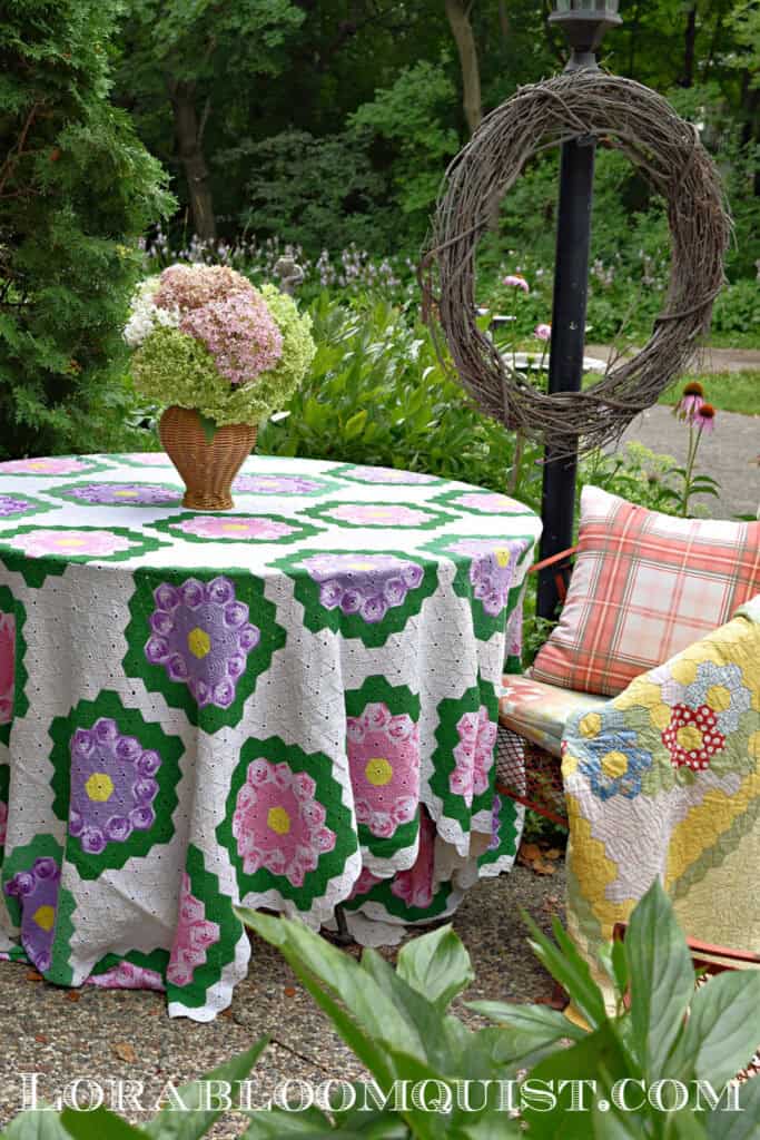 Vintage linens repurposed for summer garden party table.
