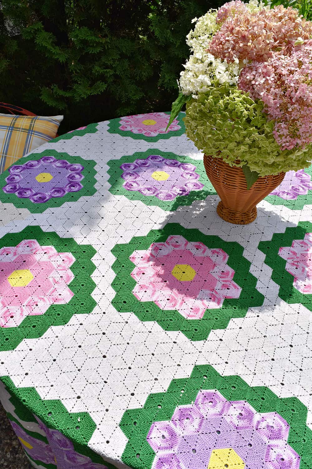 Crocheted bedspread repurposed as garden party tablecloth.
