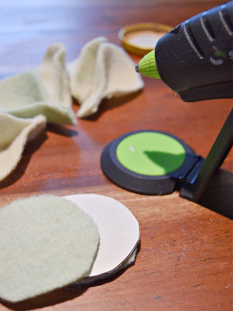 Hot gluing fabric ornaments.