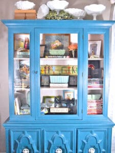 Glass front cabinets and cupboards can be a great display space for any room, like this refreshed vintage aqua painted piece.