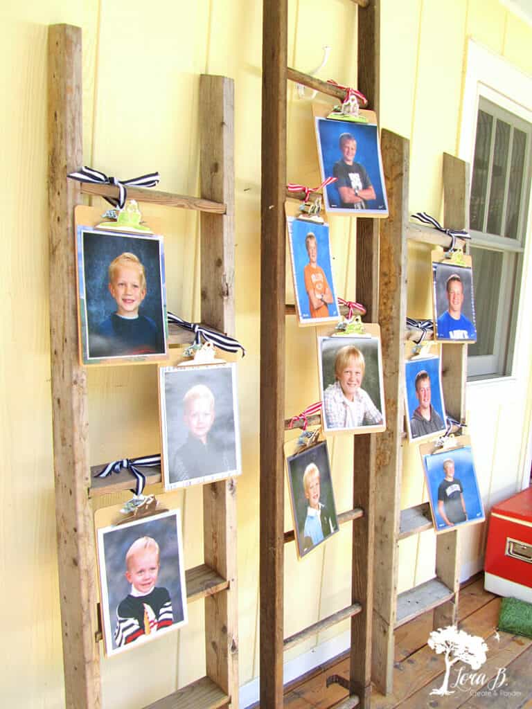 Graduation party pictures displayed on old ladders.