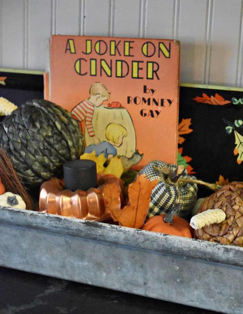 Vintage childrens book in pumpkin display.