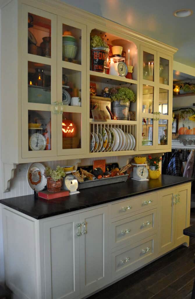 Large kitchen cupboards with Fall decor display.