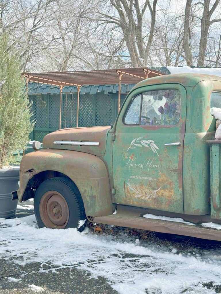 Old green pickup front.
