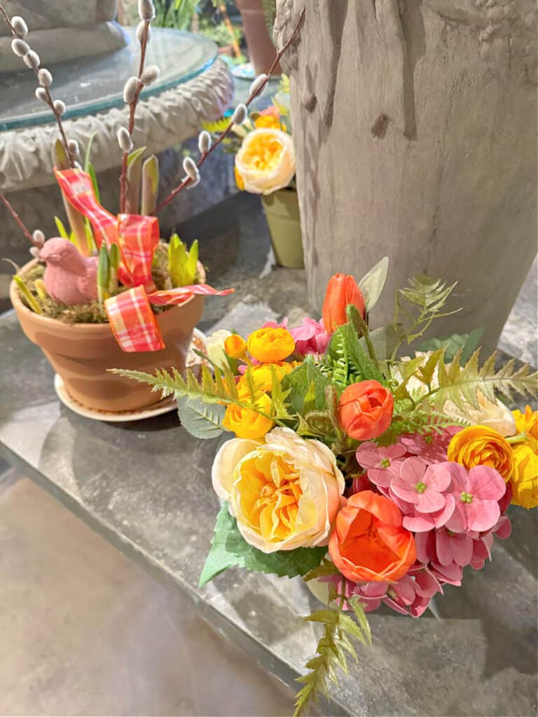 Spring floral arrangement with pink, yellow, orange.