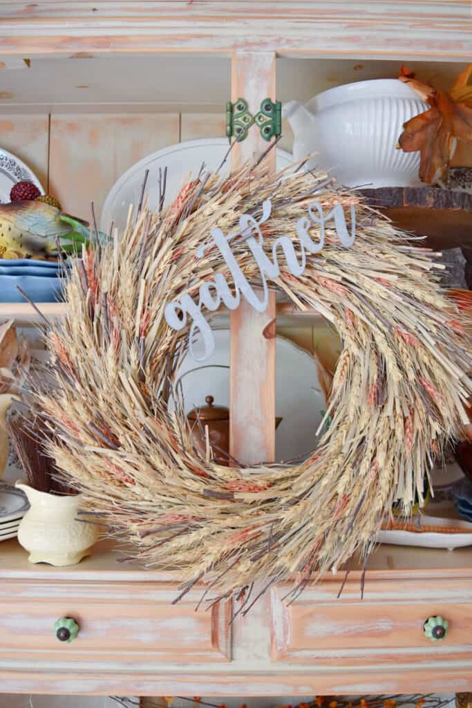 Wheat wreath with gather sign as Fall decor.