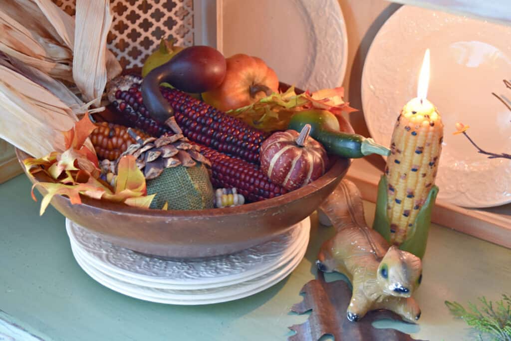 Wooden bowl with harvest natural decor.