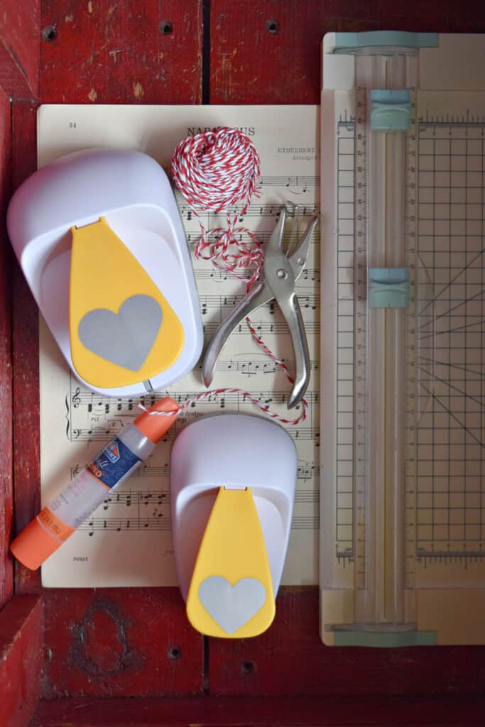 Craft supplies to make paper heart garland.