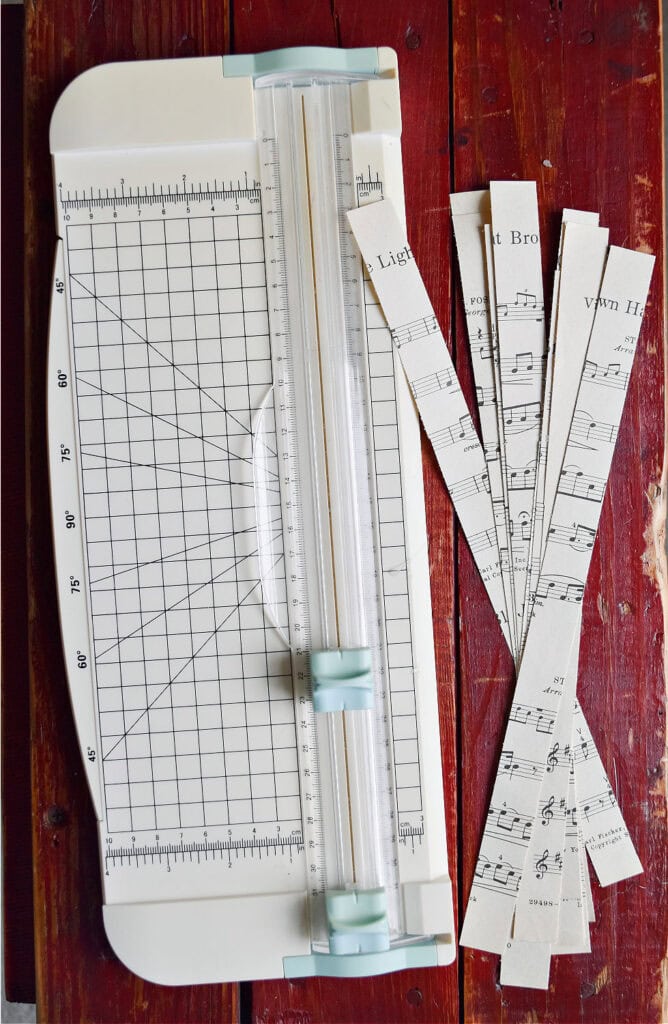 Paper cutter with strips of vintage music.