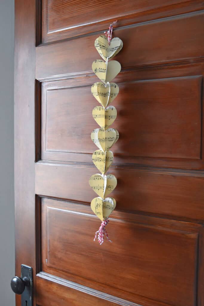 DIY paper heart garland with vintage music.