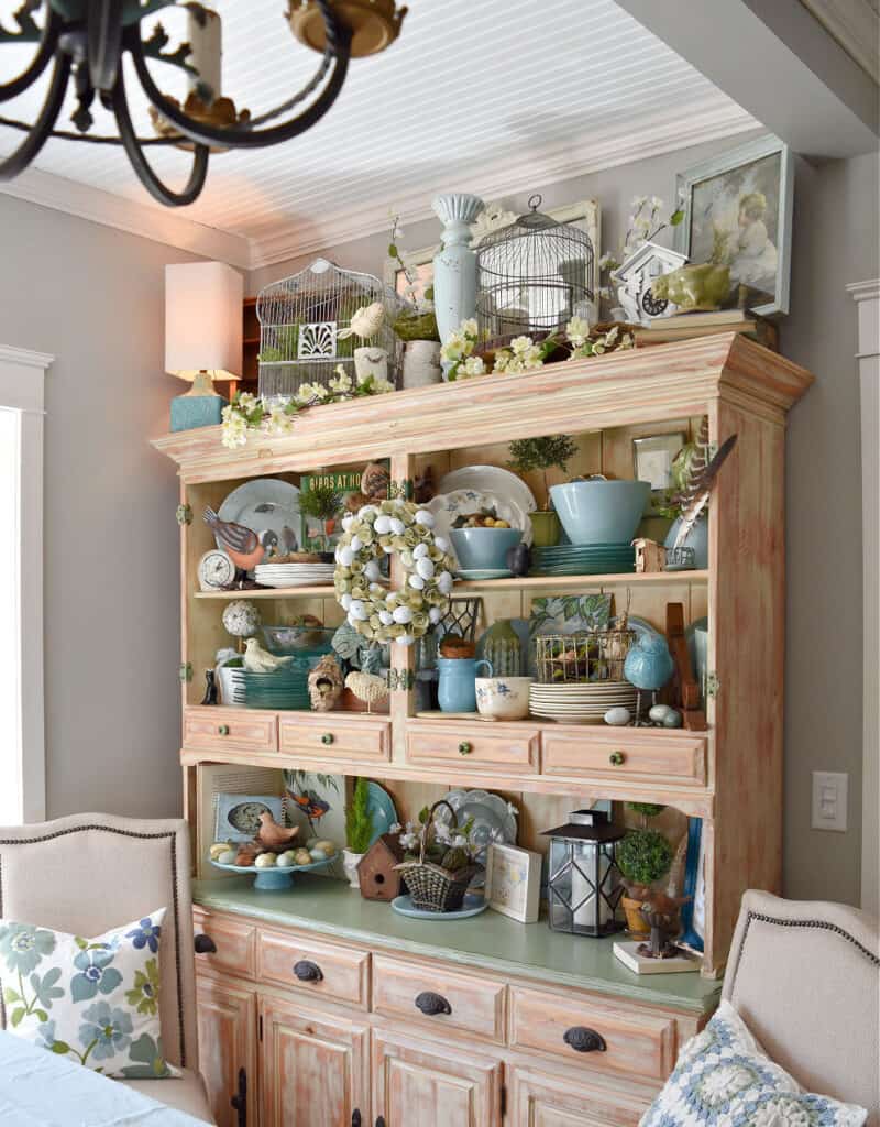 Spring decorated hutch with a bird theme.