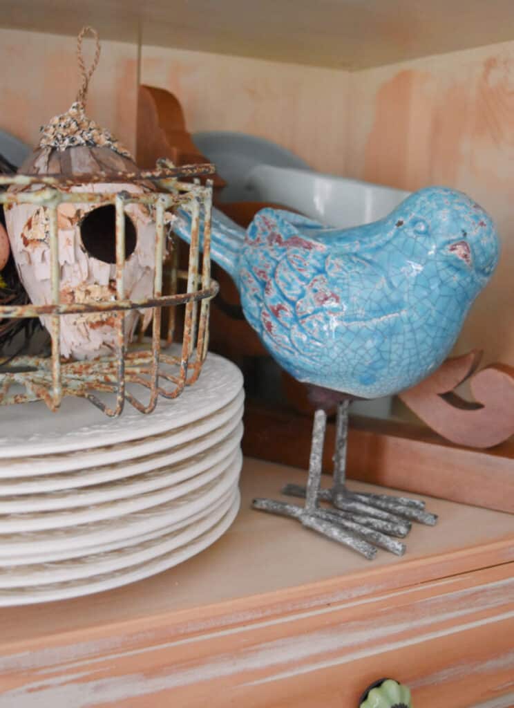 Ceramic bird figure in decor.