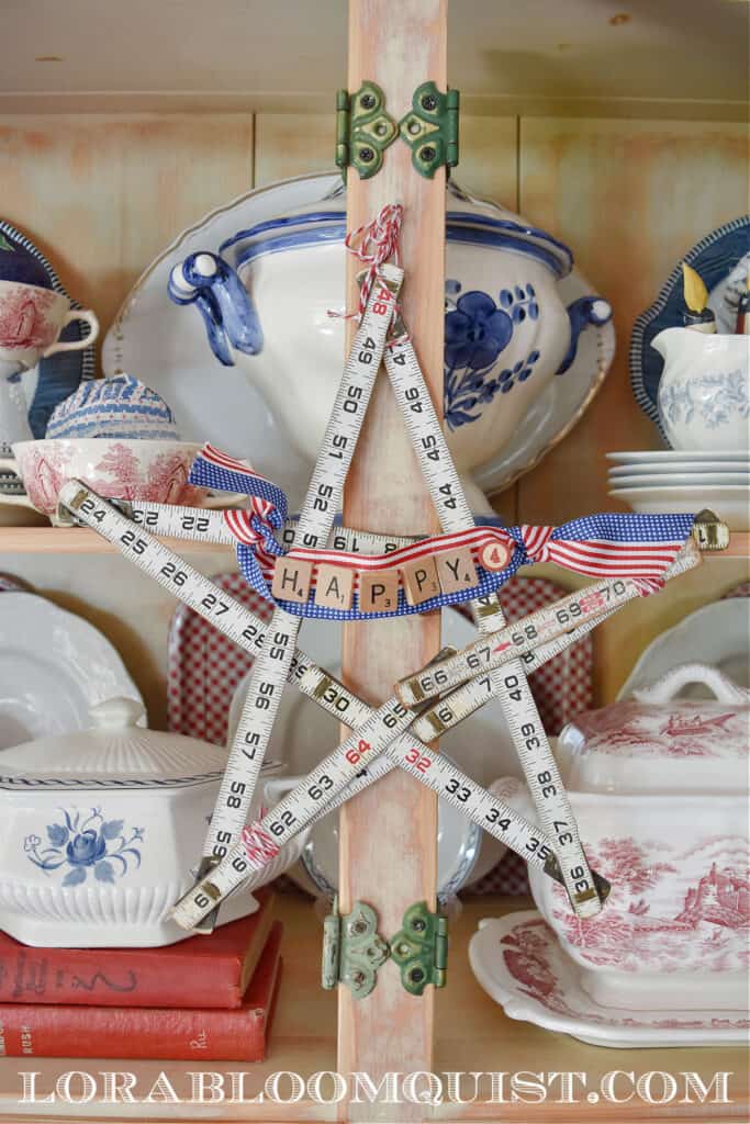 DIY vintage folding ruler star in Patriotic hutch display.