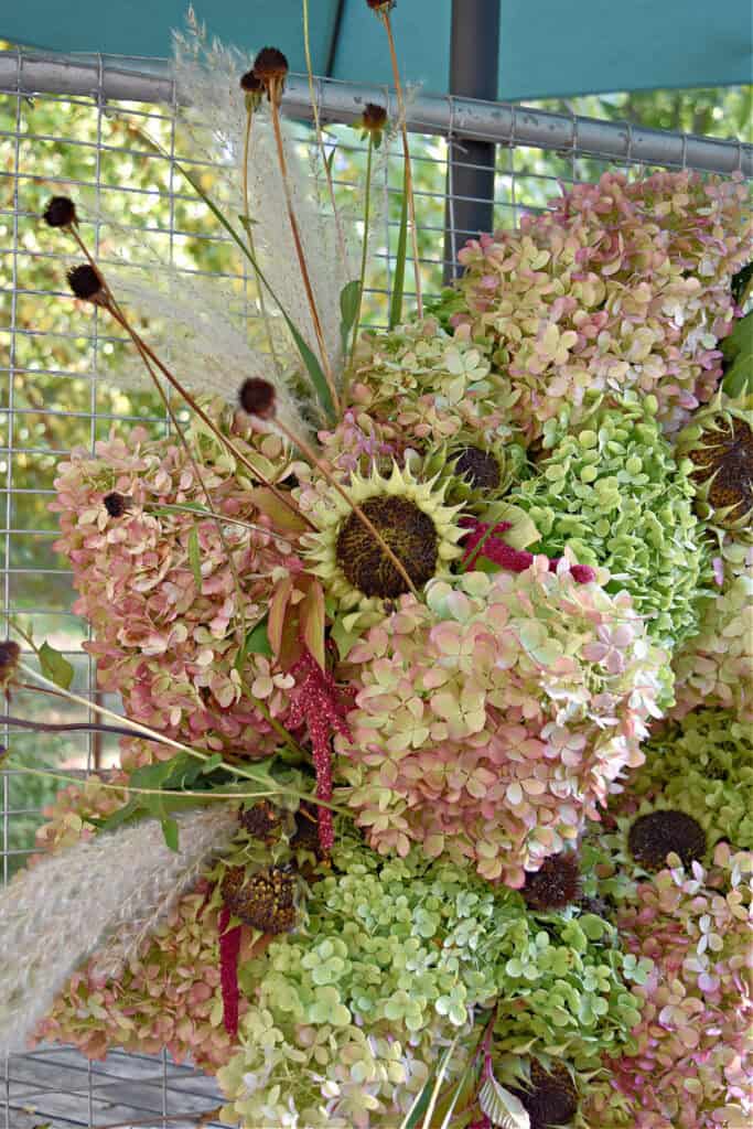 Fresh hydrangea and garden flowers on DIY wreath.