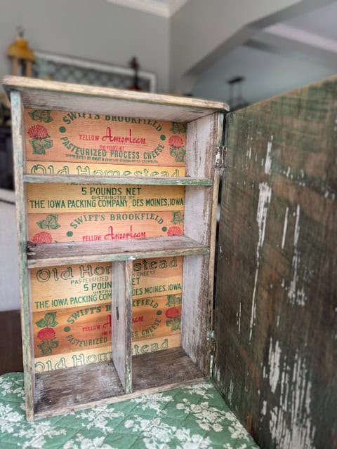 Cheese boxes in back of cabinet.
