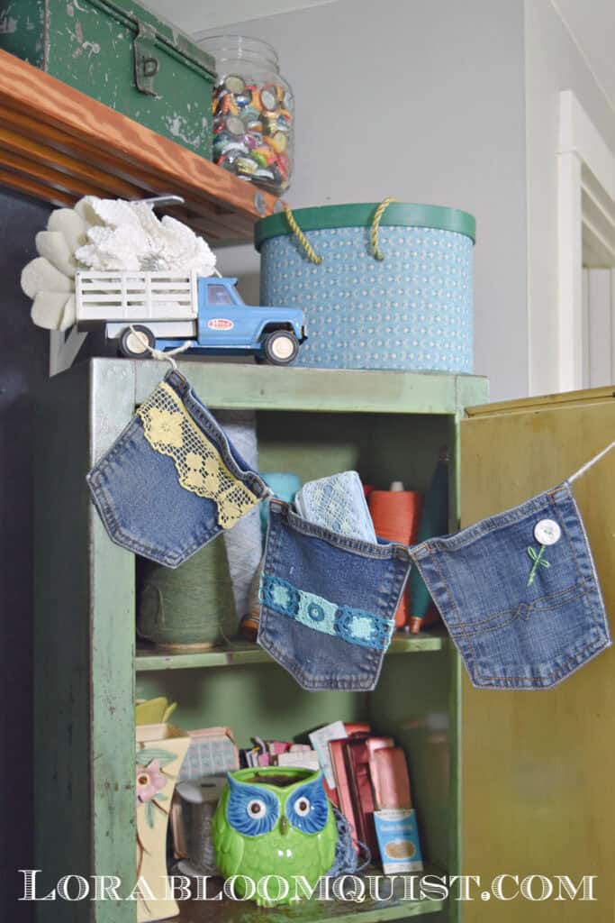 Jean pocket garland hanging in craft room.