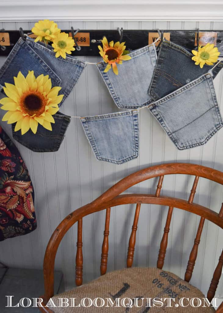 Jean pocket garland hanging from vintage hooks.