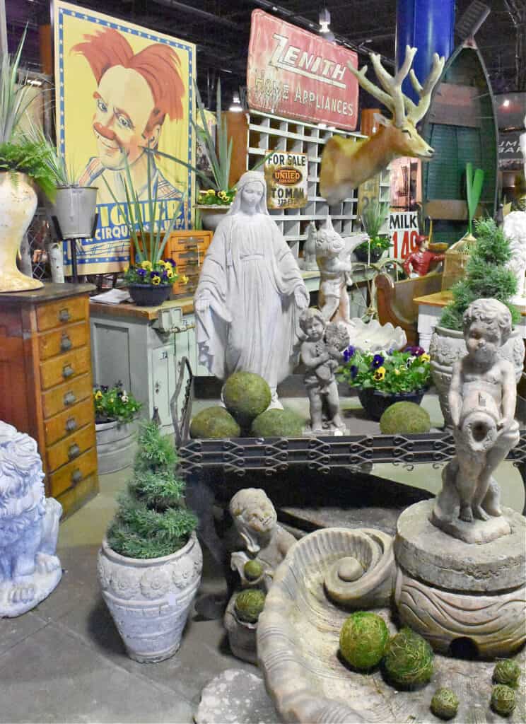 Vintage garden display with cement figurines