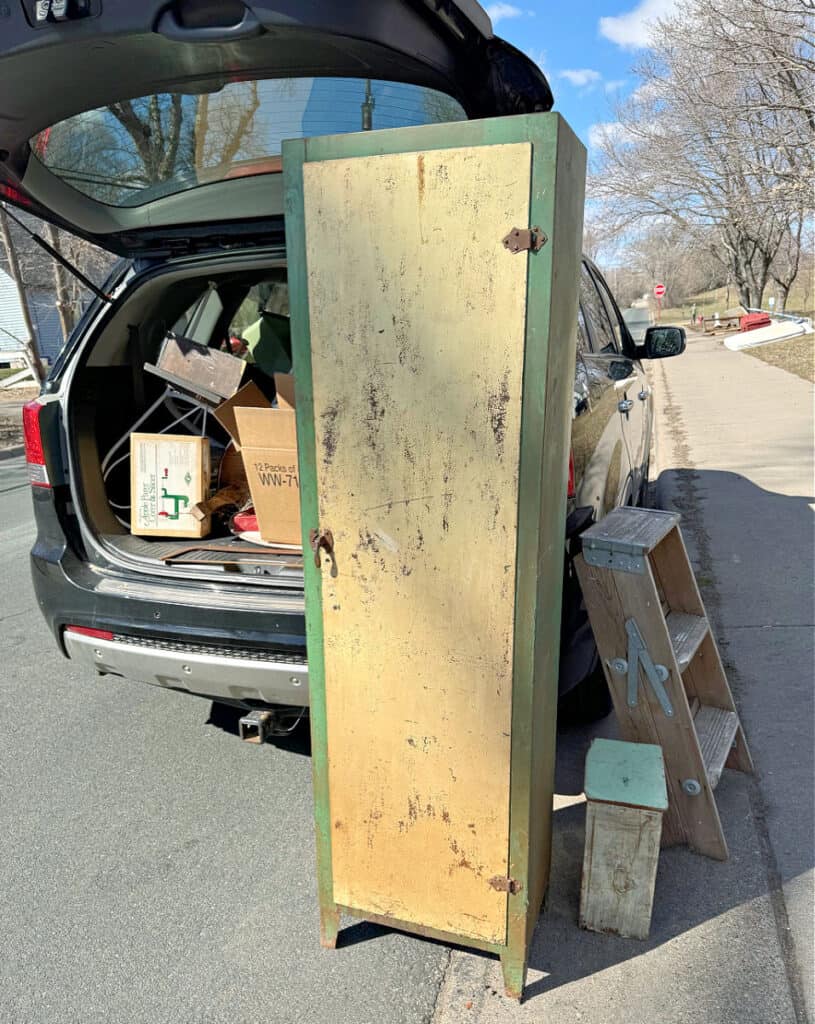 Tall vintage metal cabinet found in curbside pile.