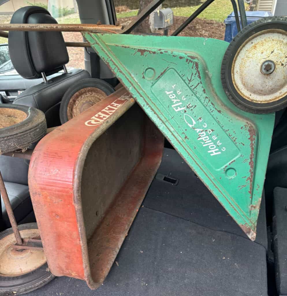 Old metal wagon and garden cart found in curbside pile.