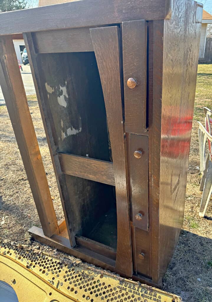 Old oak buffet in curbside pile.