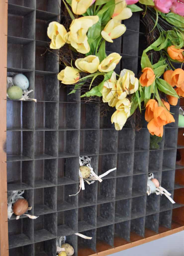 Tulip wreath on vintage organizer.