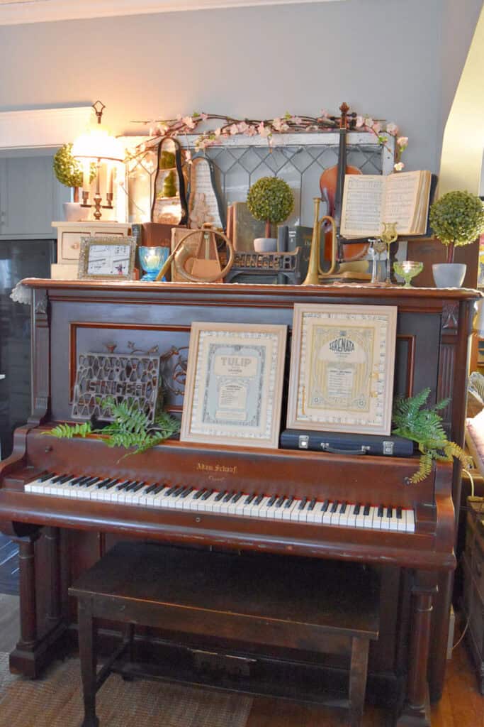 Upright antique piano with Spring decor.