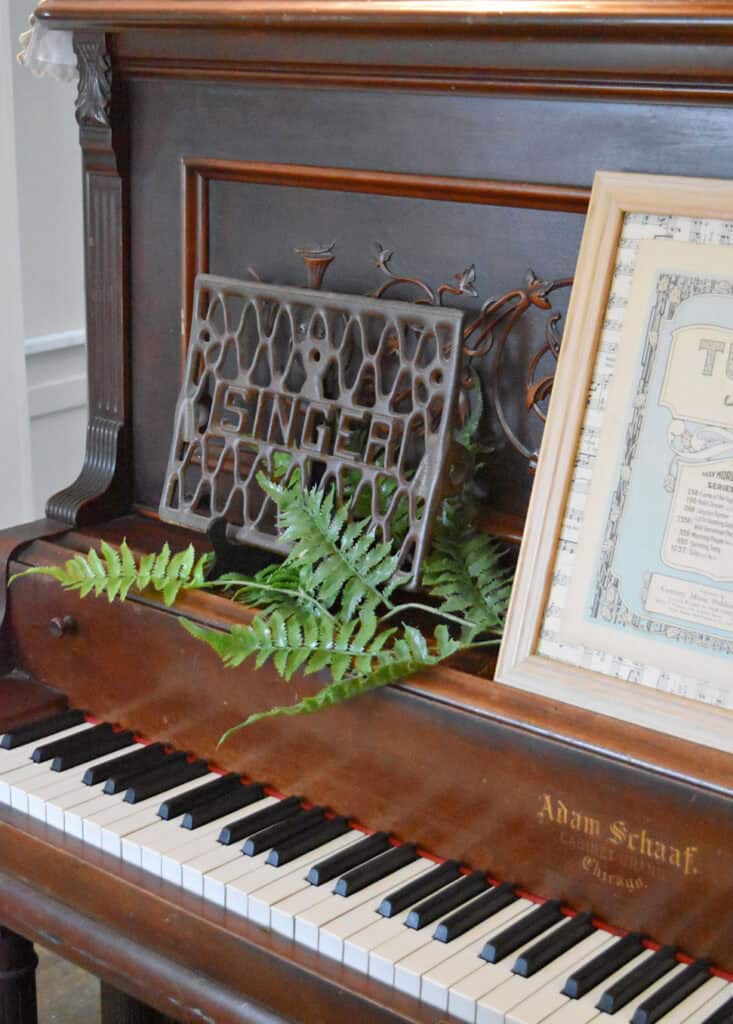 Upright antique piano with Spring decor.