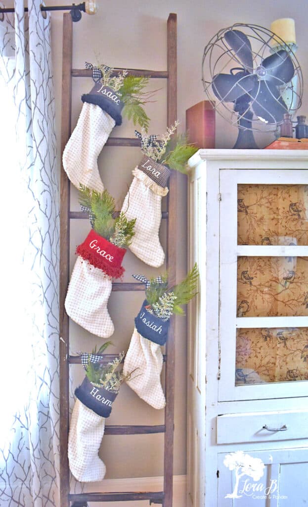 Christmas stockings displayed on a ladder