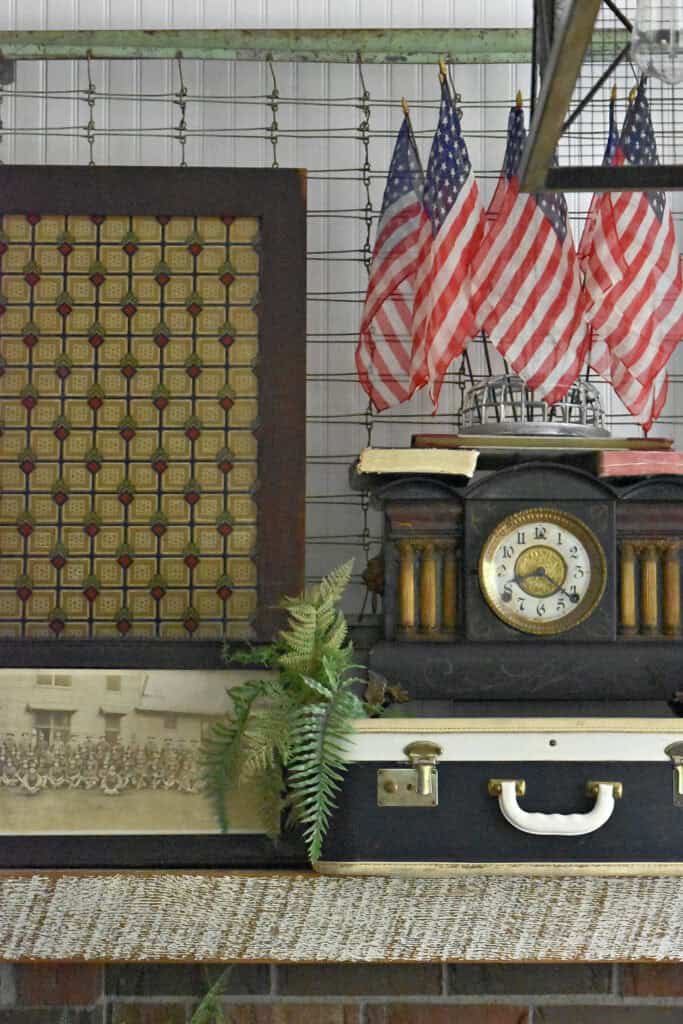 Antique federal clock, military yard long, flags and patternded glass door.