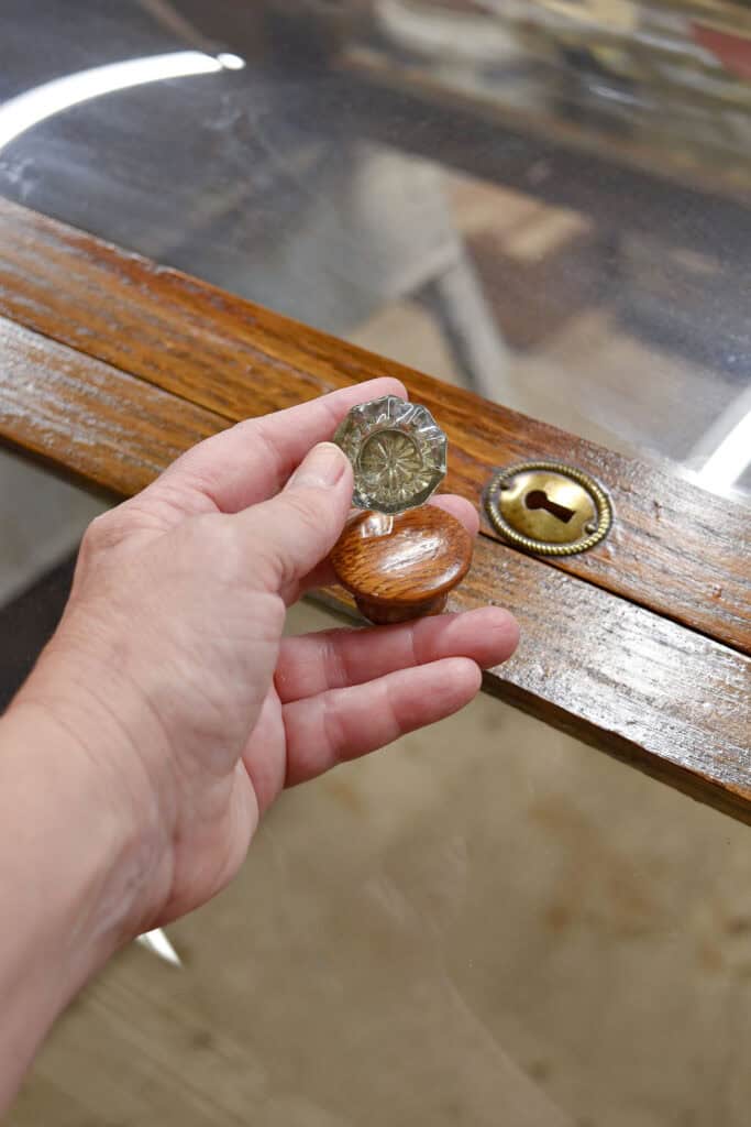 Vintage glass and wooden knobs and old keyhole.