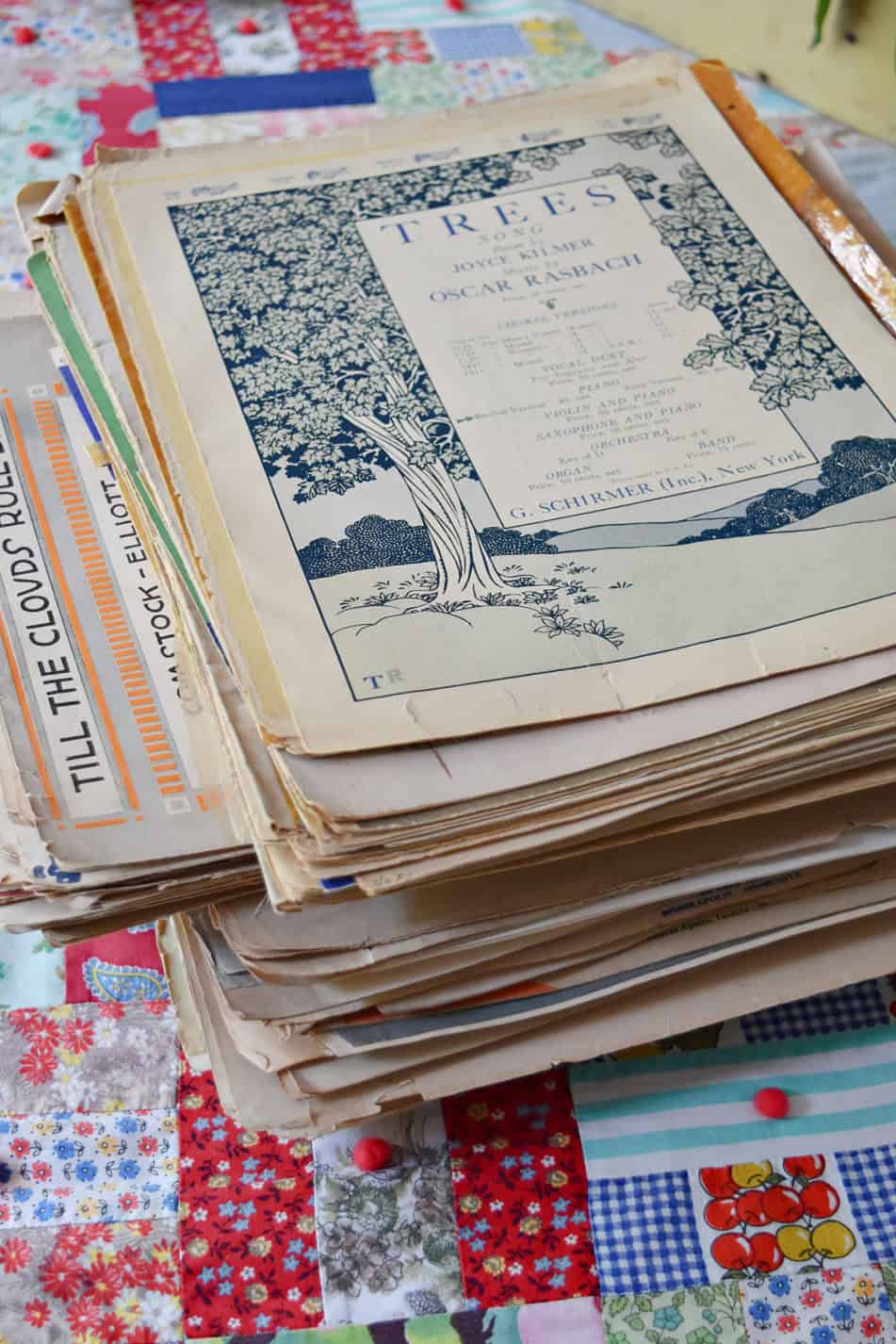 Stack of vintage sheet music.