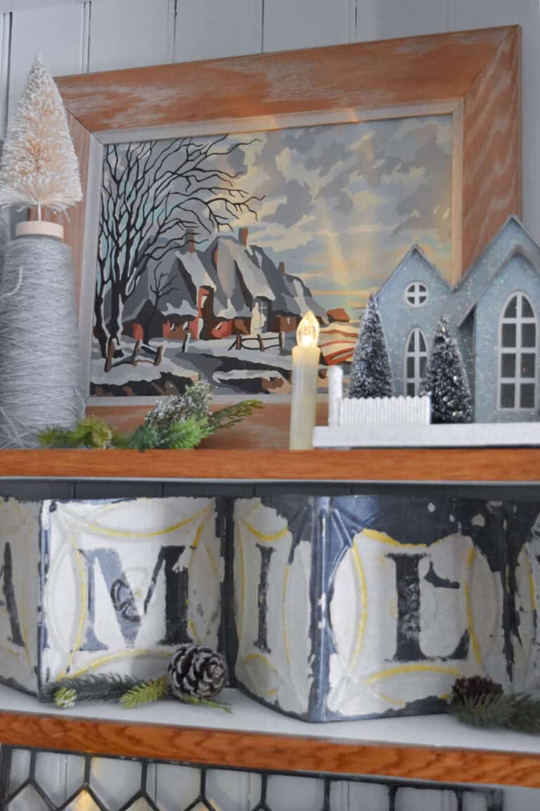 Winter cottage paint by number in bookshelf styling.