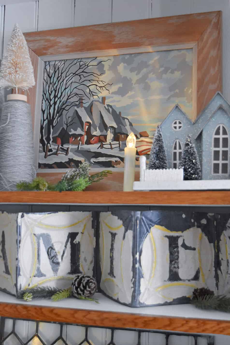 Winter cottage paint by number in bookshelf styling.