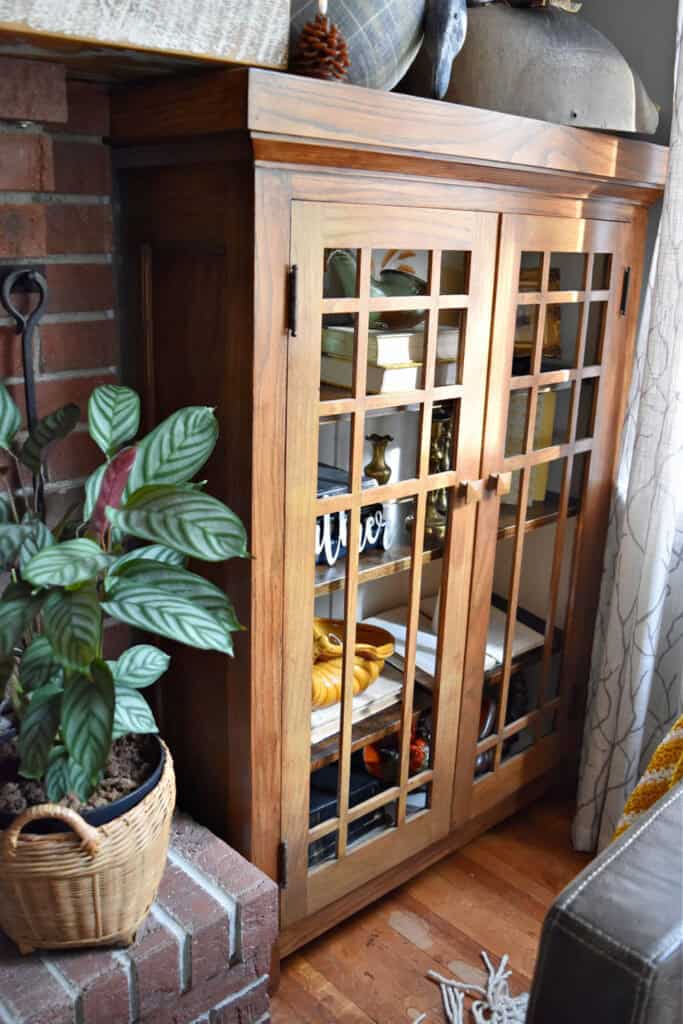 Craftsman styled built in by brick fireplace.