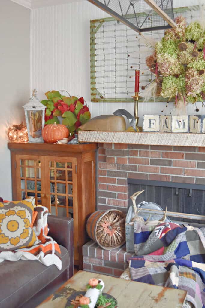 Craftsman styled built ins next to brick fireplace.