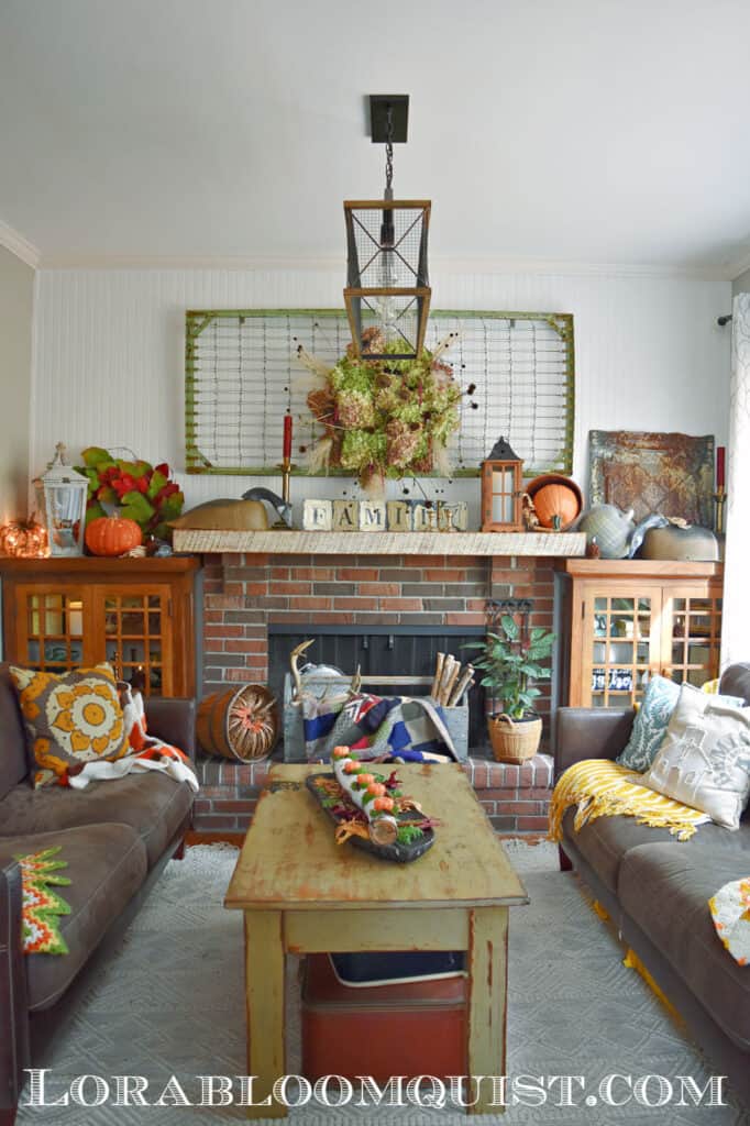 Brick fireplace in old house living room with built ins.